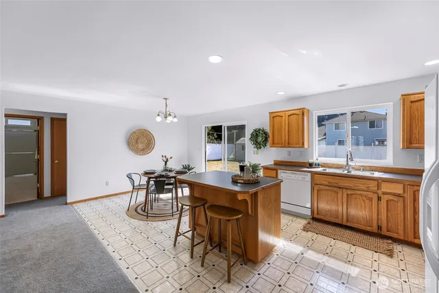 a view of a kitchen area and dining room