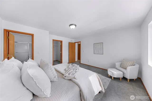 a bedroom with a bed and a couch