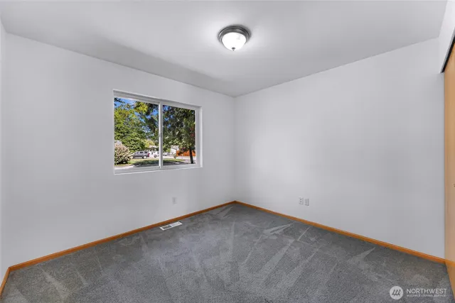 a backyard of a house with yard and outdoor seating