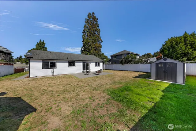 a view of swimming pool with a table and chairs