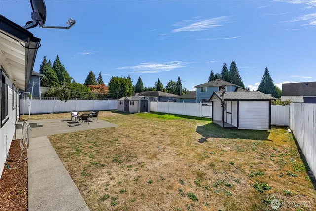 a view of a swimming pool with lounge chairs