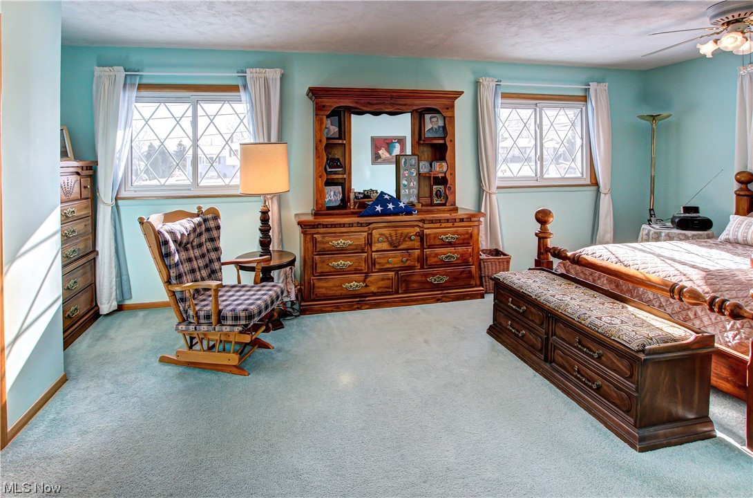 3711 Ruth Drive Brunswick, OH 44212 - Photo 14 of 35 Bedroom with light carpet, ceiling fan, and a textured ceiling