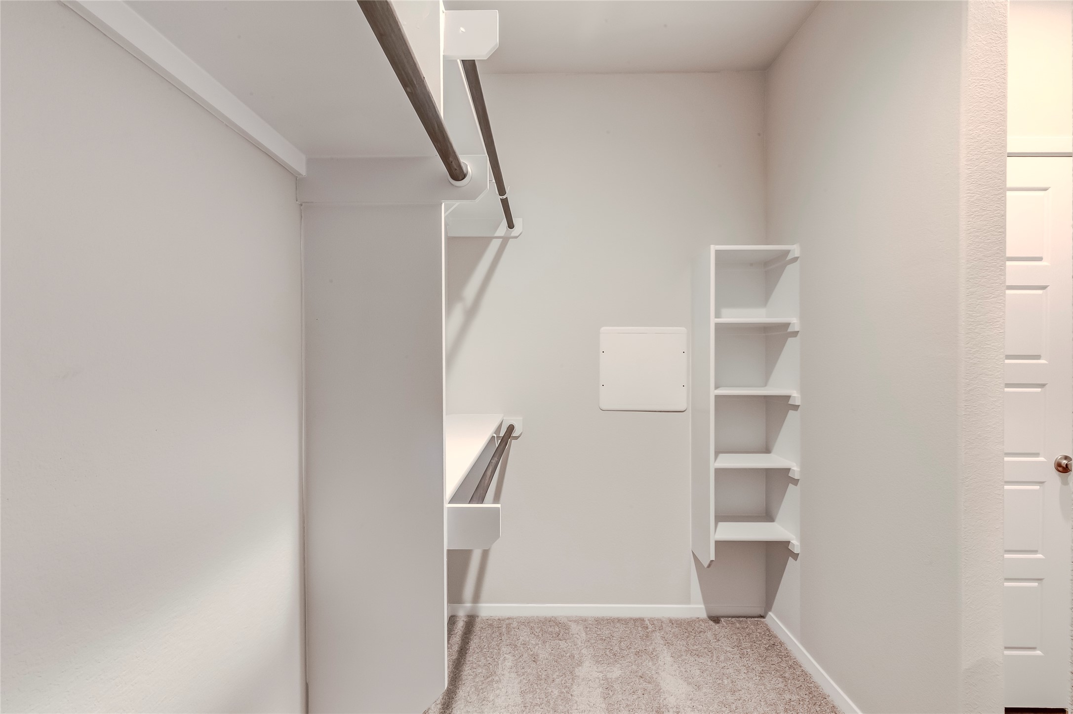 274 Jade Street Maxwell, TX 78656 - Photo 13 of 36 a view of walk in closet with empty racks