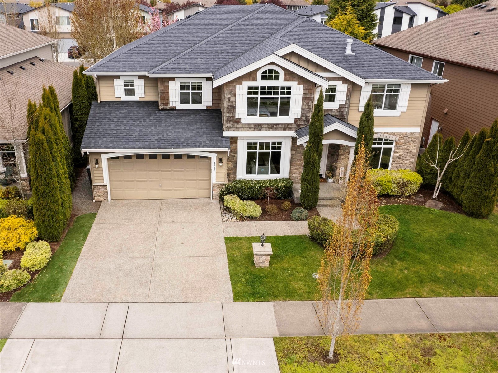 3807 209th Street Southeast Bothell, WA 98021 - Photo 1 of 36 a front view of a house with garden