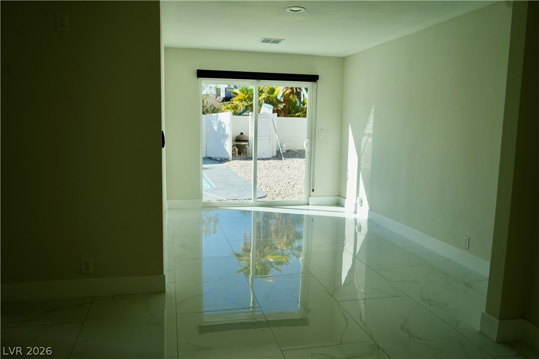 2351 Valleywood Road Henderson, NV 89014 - Photo 18 of 43 Unfurnished room with baseboards and light marble finish floors