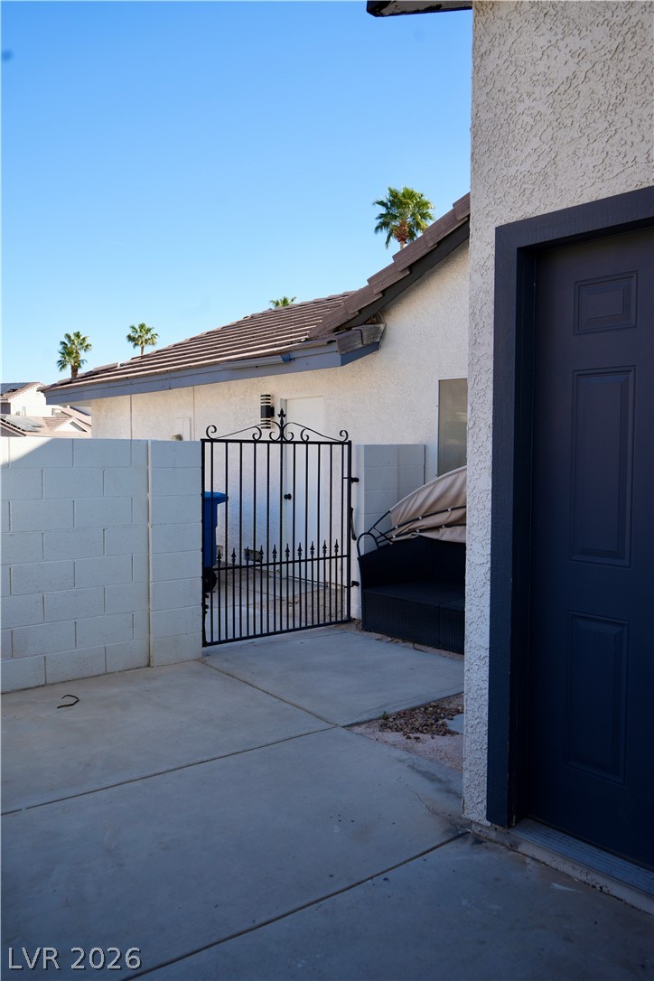 2351 Valleywood Road Henderson, NV 89014 - Photo 27 of 43 Gate featuring a patio