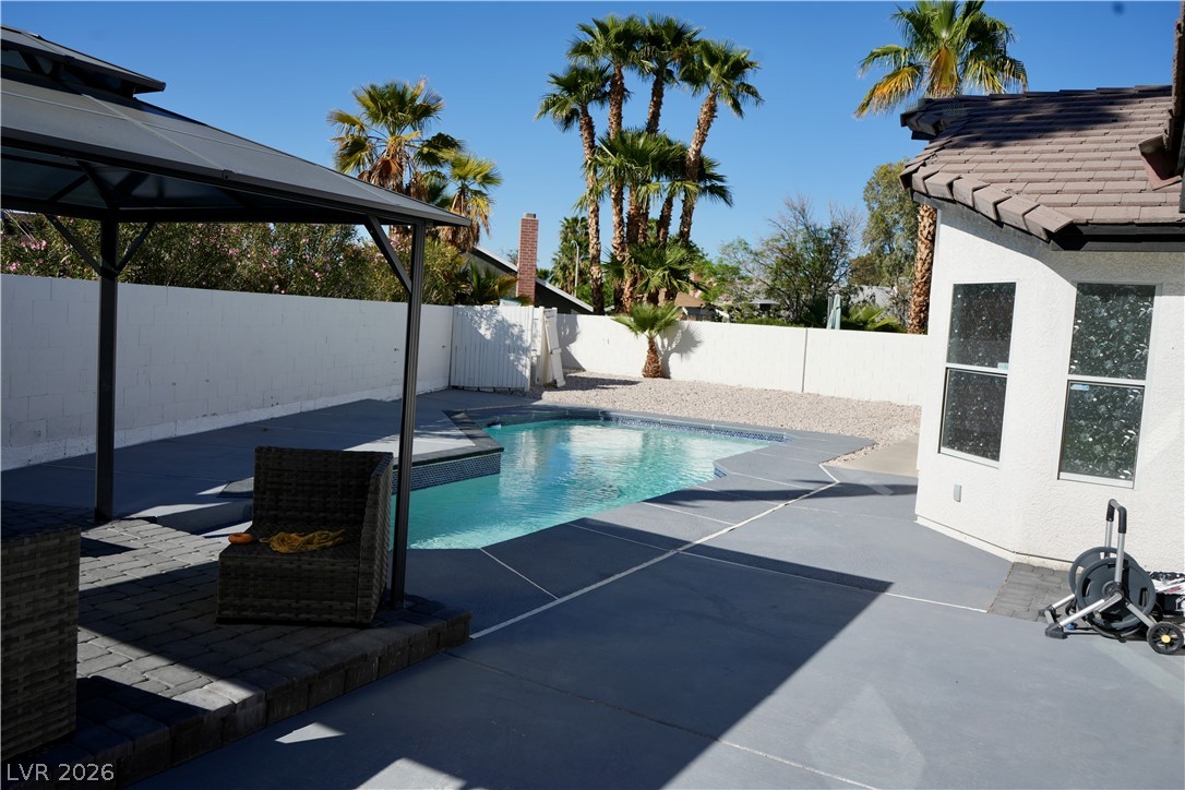 2351 Valleywood Road Henderson, NV 89014 - Photo 34 of 43 View of swimming pool with patio surround, a gazebo, and a fenced backyard