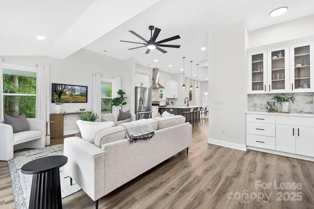 a living room with furniture and a large window