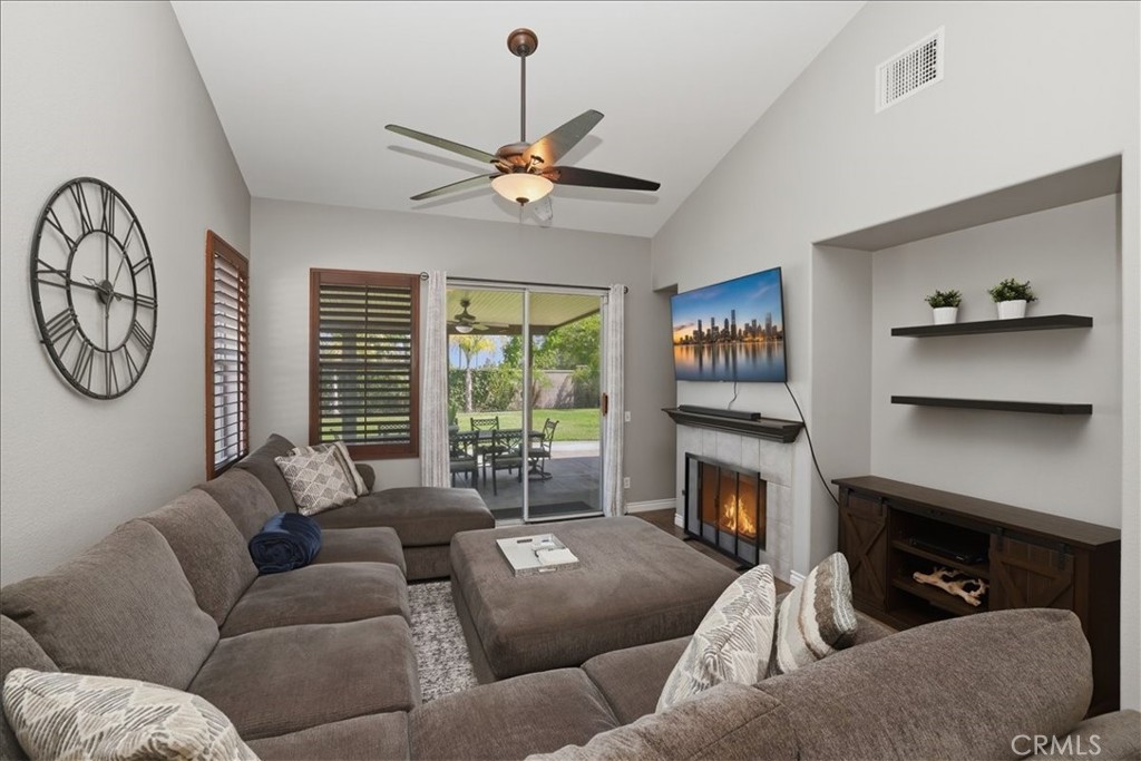 8509 Cabin Place Riverside, CA 92508 - Photo 12 of 67 Everyday comfort in the family room with a view of the backyard, patio dining and open to the kitchen.