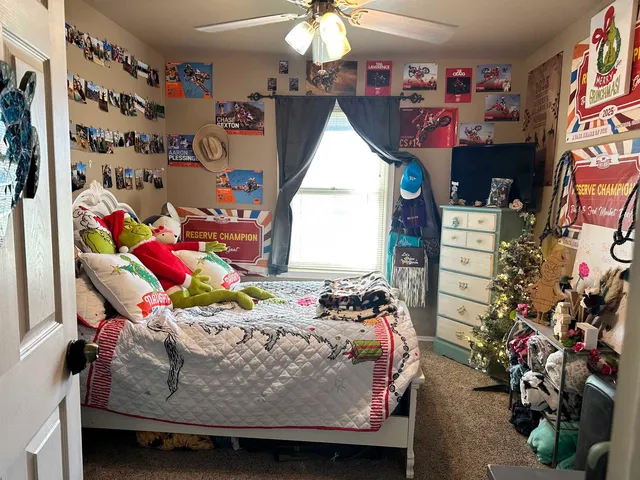 a bed room with a bed and a window