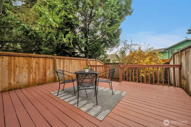 a view of a house with wooden fence