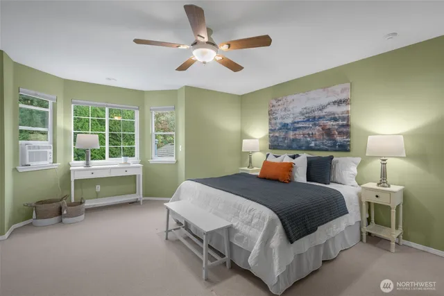 a bed room with a bed and a chandelier