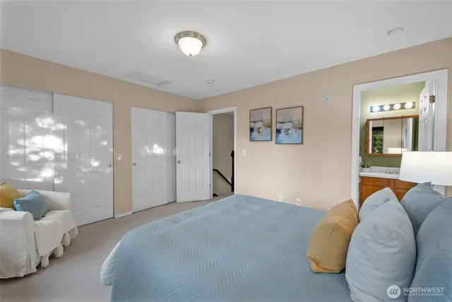 a bathroom with a sink vanity mirror and toilet
