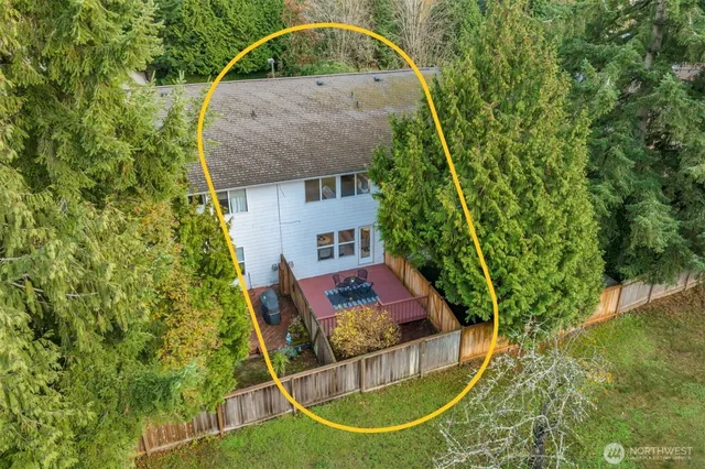 an aerial view of a houses with a swimming pool