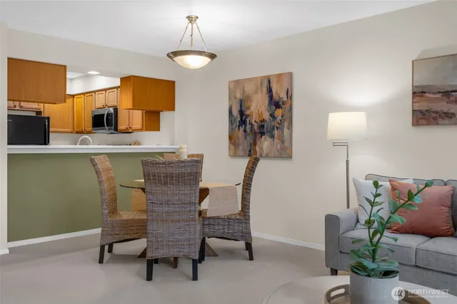 a view of a dining room with furniture and chandelier