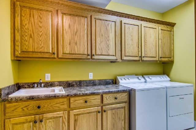 112 Revilo Road Leoma, TN 38468 - Photo 15 of 20 Amazing laundry room that features cabinets, sink and big closet. Lots of space.
