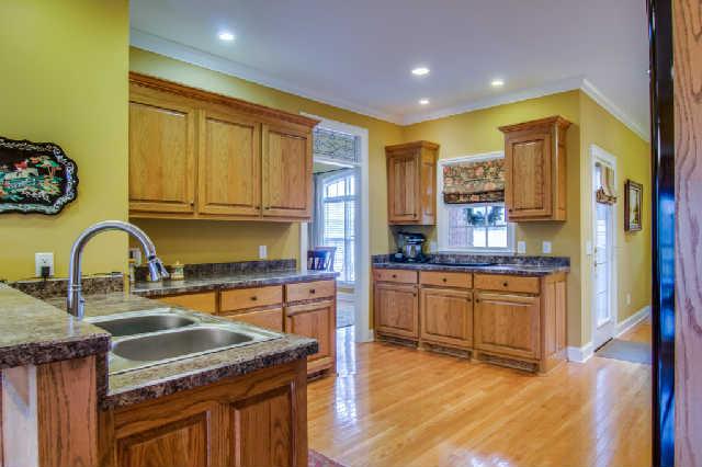 112 Revilo Road Leoma, TN 38468 - Photo 8 of 20 Open kitchen with countless cabinets and counter space. Breakfast room is to your left and laundry and garage down the hall to your right.