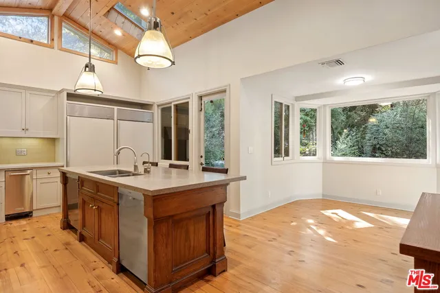 a bathroom with a shower and a glass door