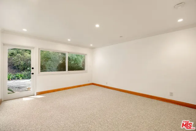 a bathroom with a granite countertop sink a shower and a mirror