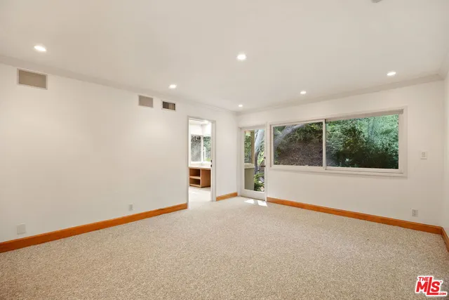 a bathroom with a shower and a glass door