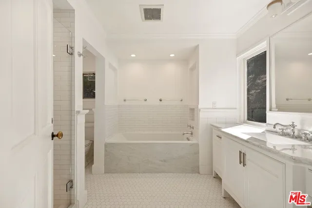a bathroom with a sink toilet and vanity