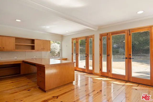 a bathroom with a granite countertop toilet sink and mirror
