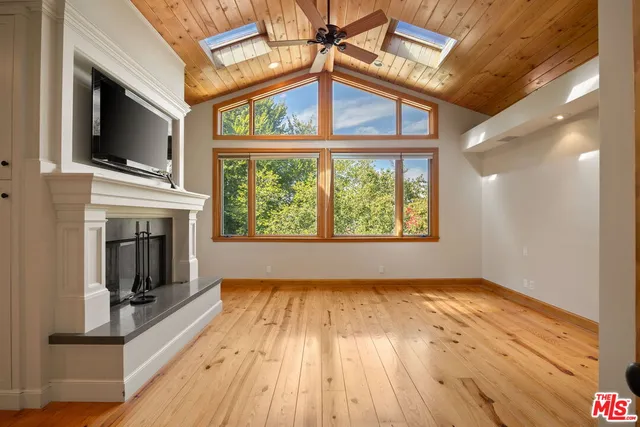 a spacious bathroom with a granite countertop sink mirror and a