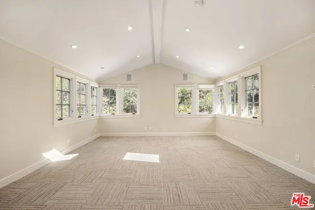 a view of a white house with swimming pool in front of it