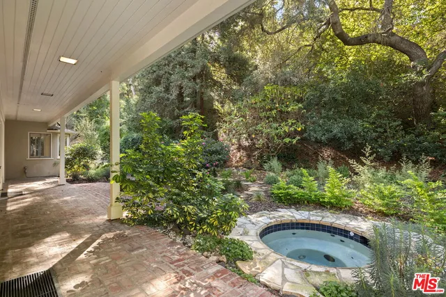 a view of a yard with an outdoor space