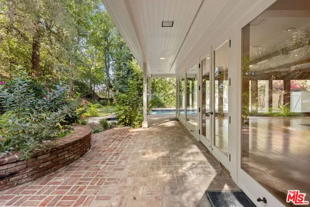 a view of a house with a tree