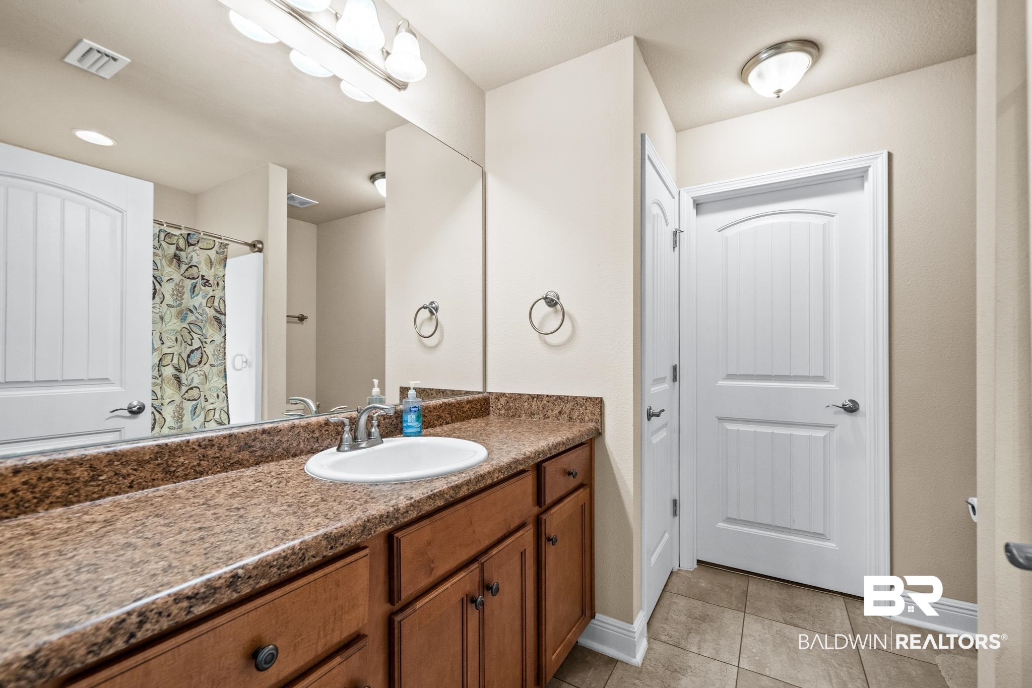 17069 Russet Court Foley, AL 36535 - Photo 13 of 27 Bathroom featuring tile patterned floors and vanity
