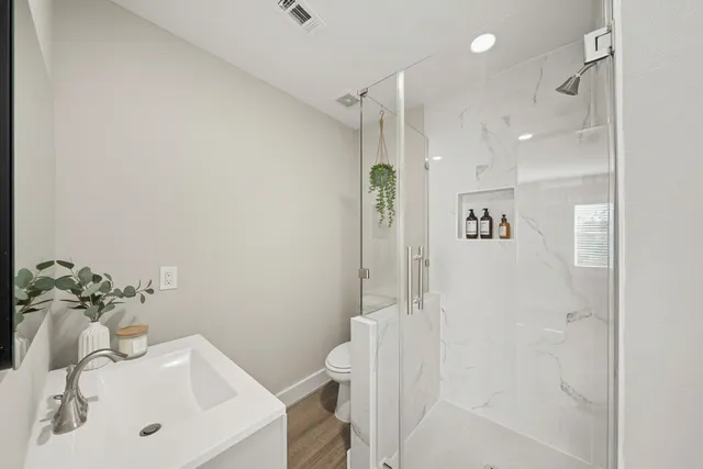 a bathroom with a sink and shower
