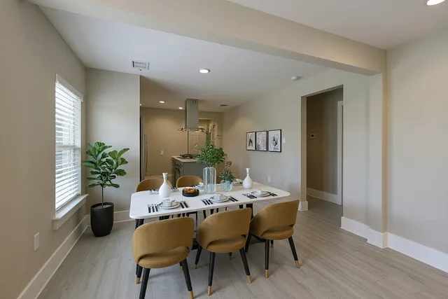 a dining room with furniture and window