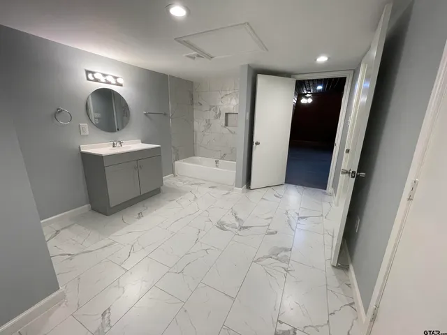 a view of balcony with wooden floor and seating space