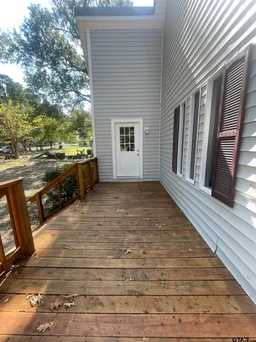 a view of a house with trees in the background