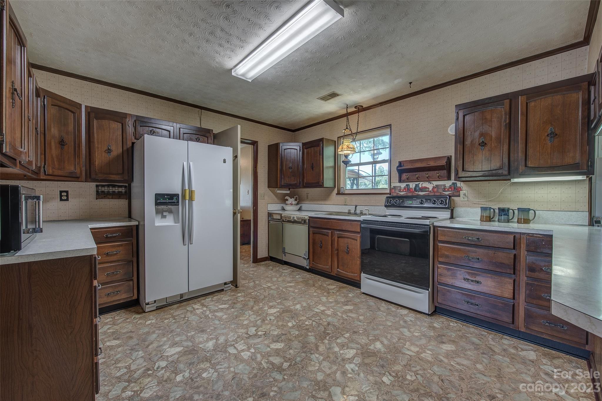2141 New Prospect Church Road Shelby, NC 28150 - Photo 11 of 43 a kitchen with stainless steel appliances a refrigerator and a stove top oven