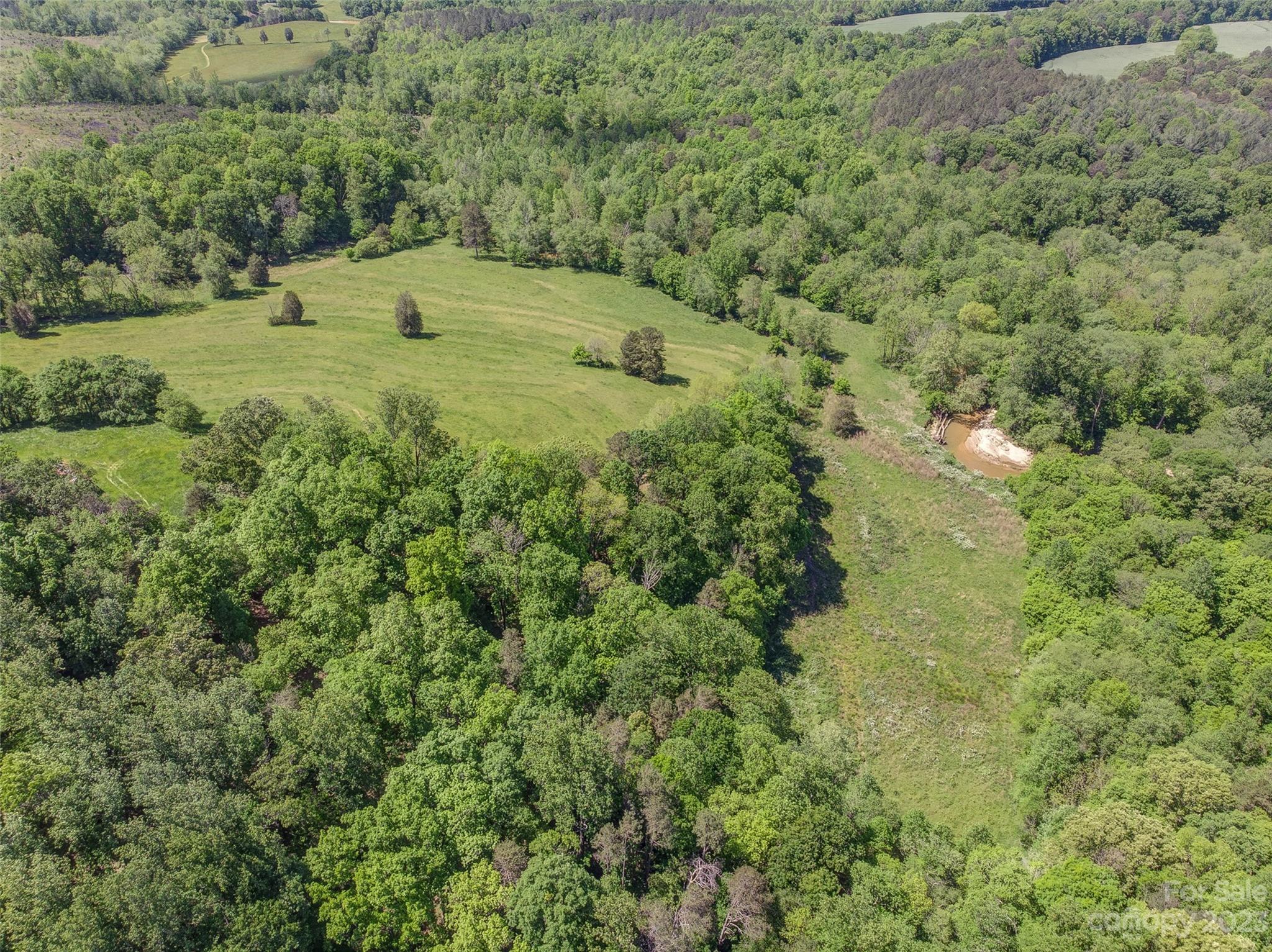 2141 New Prospect Church Road Shelby, NC 28150 - Photo 28 of 43 a view of a field with plants and trees all around