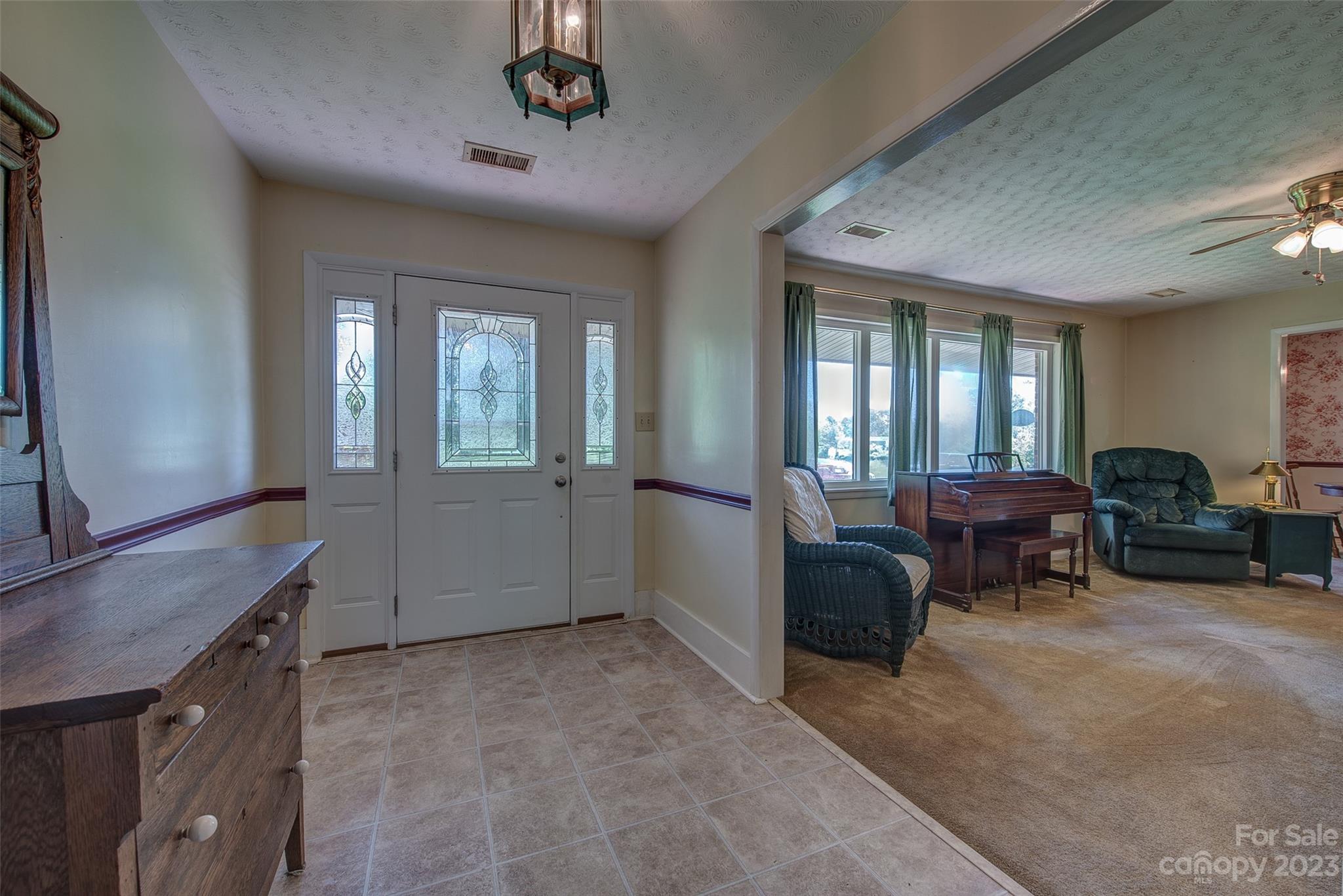 2141 New Prospect Church Road Shelby, NC 28150 - Photo 3 of 43 a living room with furniture and a chandelier