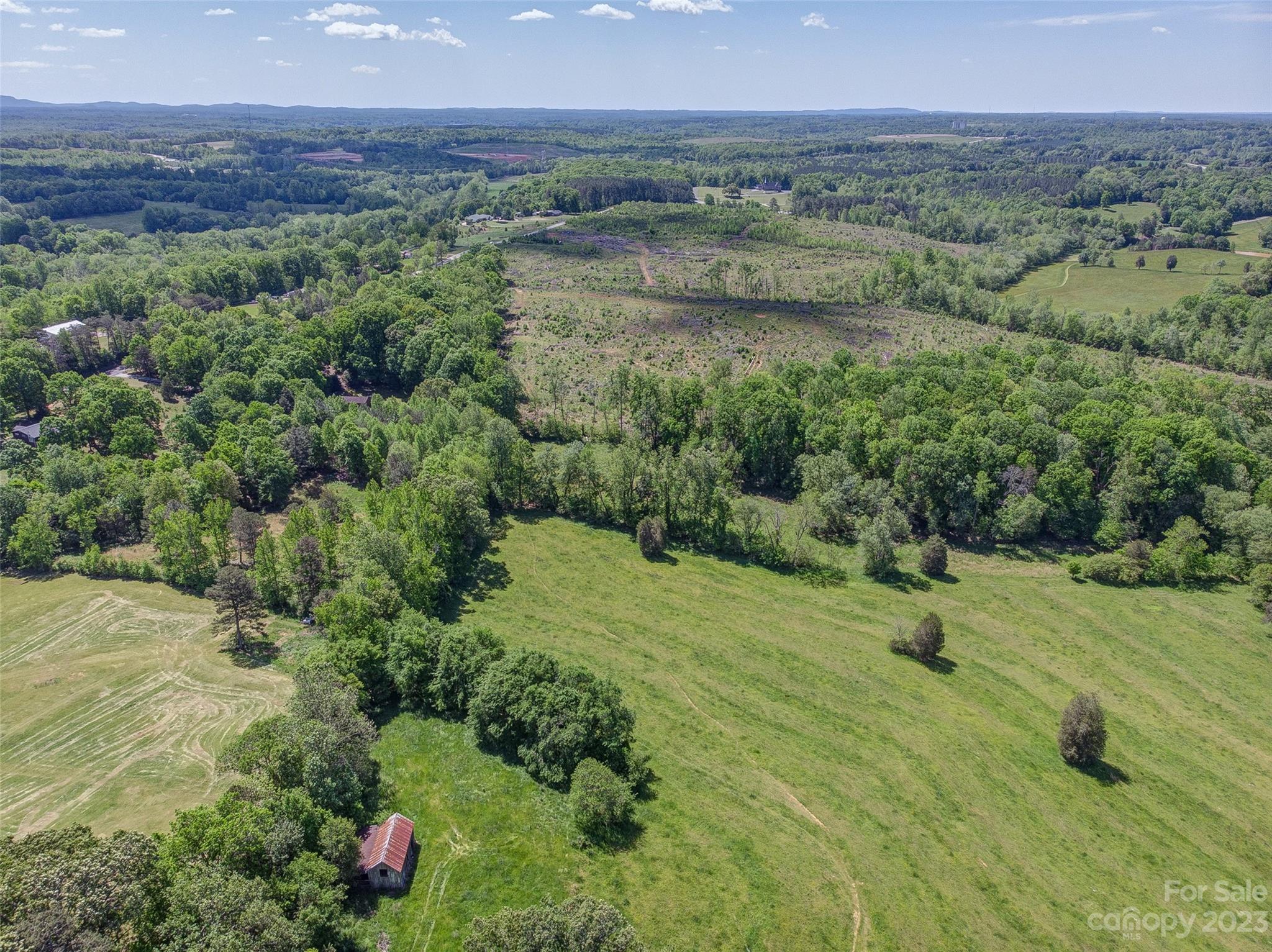 2141 New Prospect Church Road Shelby, NC 28150 - Photo 31 of 43 a view of a garden with a house in the background