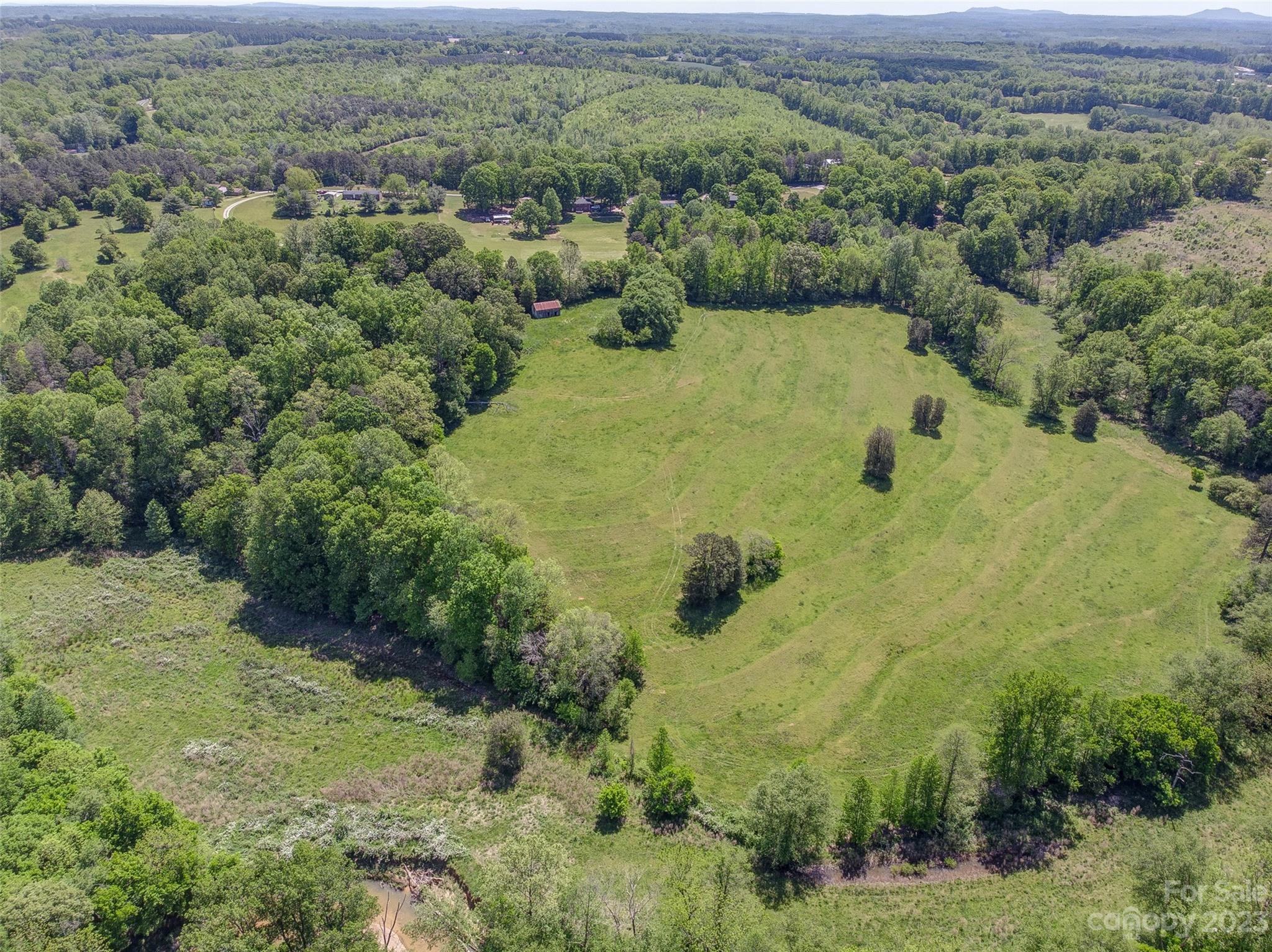 2141 New Prospect Church Road Shelby, NC 28150 - Photo 34 of 43 a view of a forest with a yard