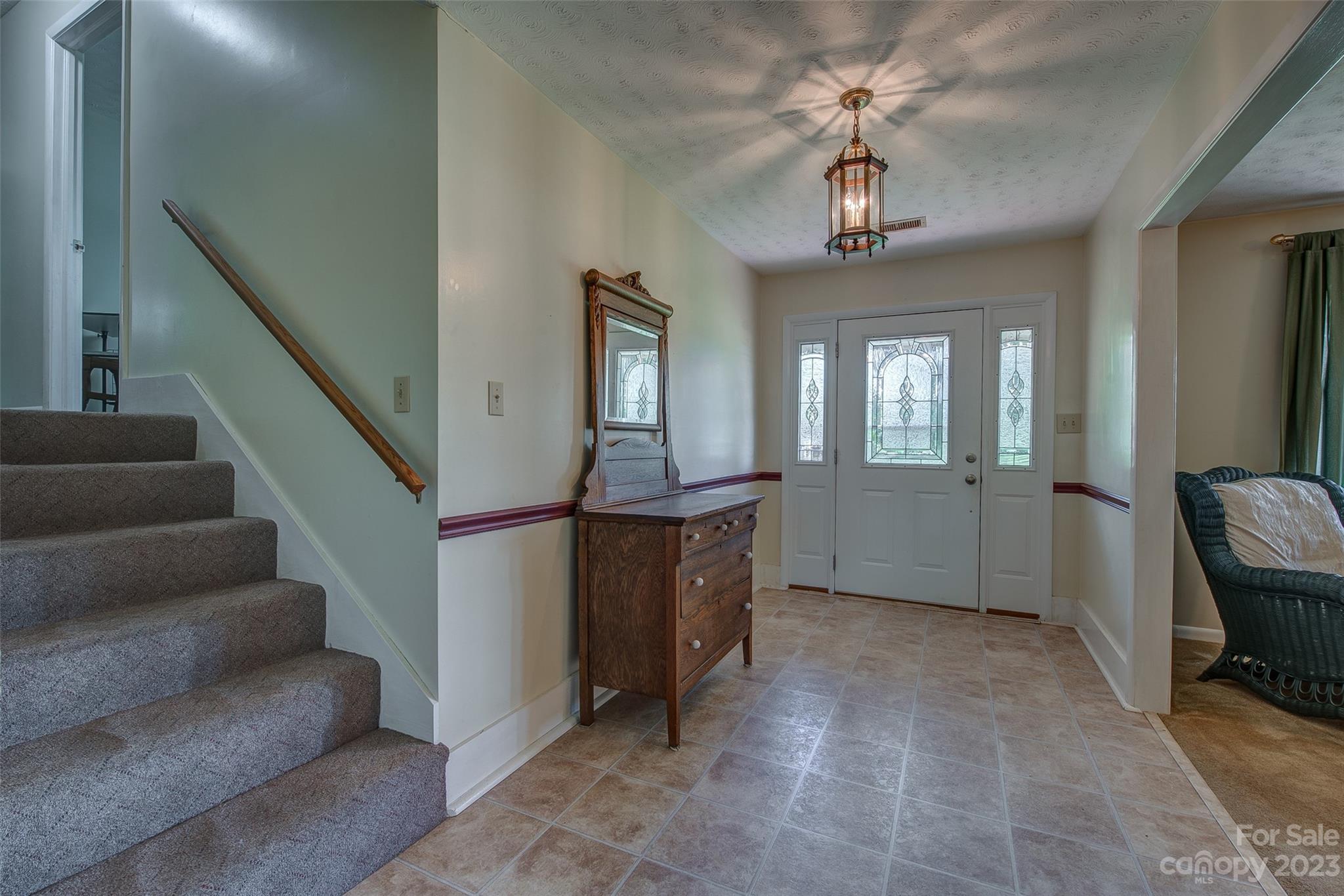 2141 New Prospect Church Road Shelby, NC 28150 - Photo 4 of 43 a view of a livingroom with furniture staircase and windows