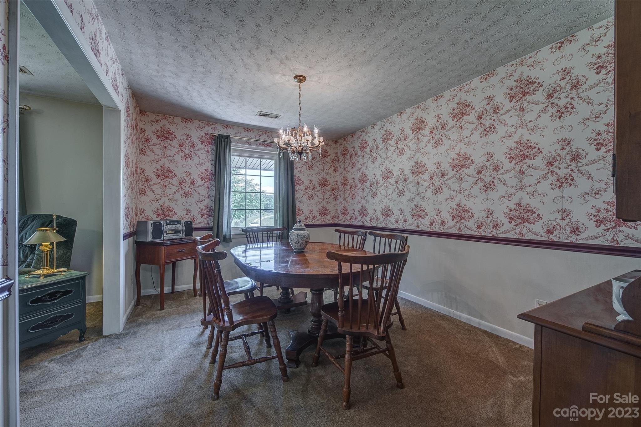 2141 New Prospect Church Road Shelby, NC 28150 - Photo 8 of 43 a view of a dining room with furniture and chandelier
