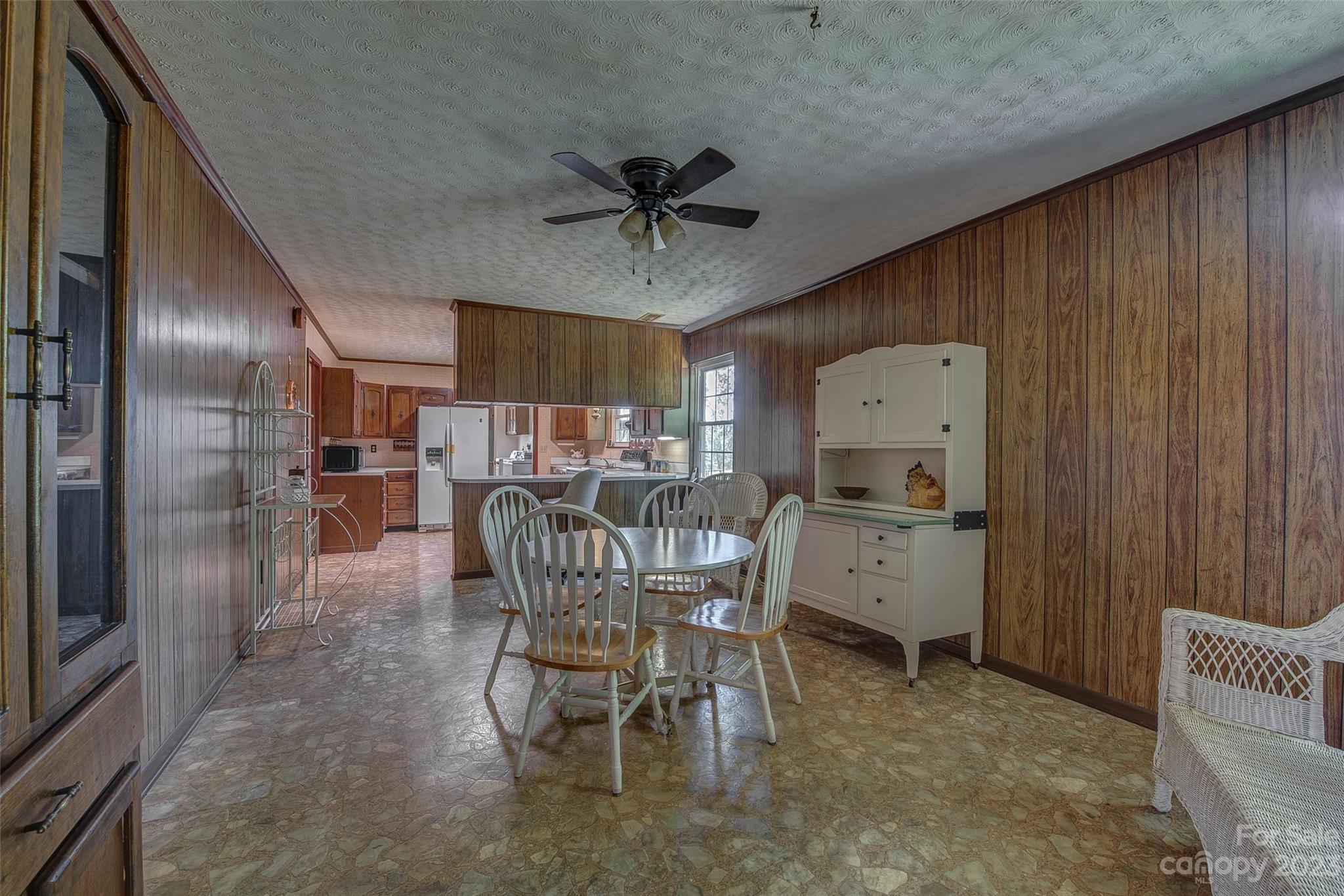 2141 New Prospect Church Road Shelby, NC 28150 - Photo 10 of 43 a dining room with furniture and a chandelier