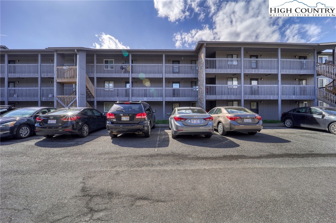 128 Zeb Street, Unit A106 Boone, NC 28607 - Photo 21 of 22 a view of a cars parked in front of a building