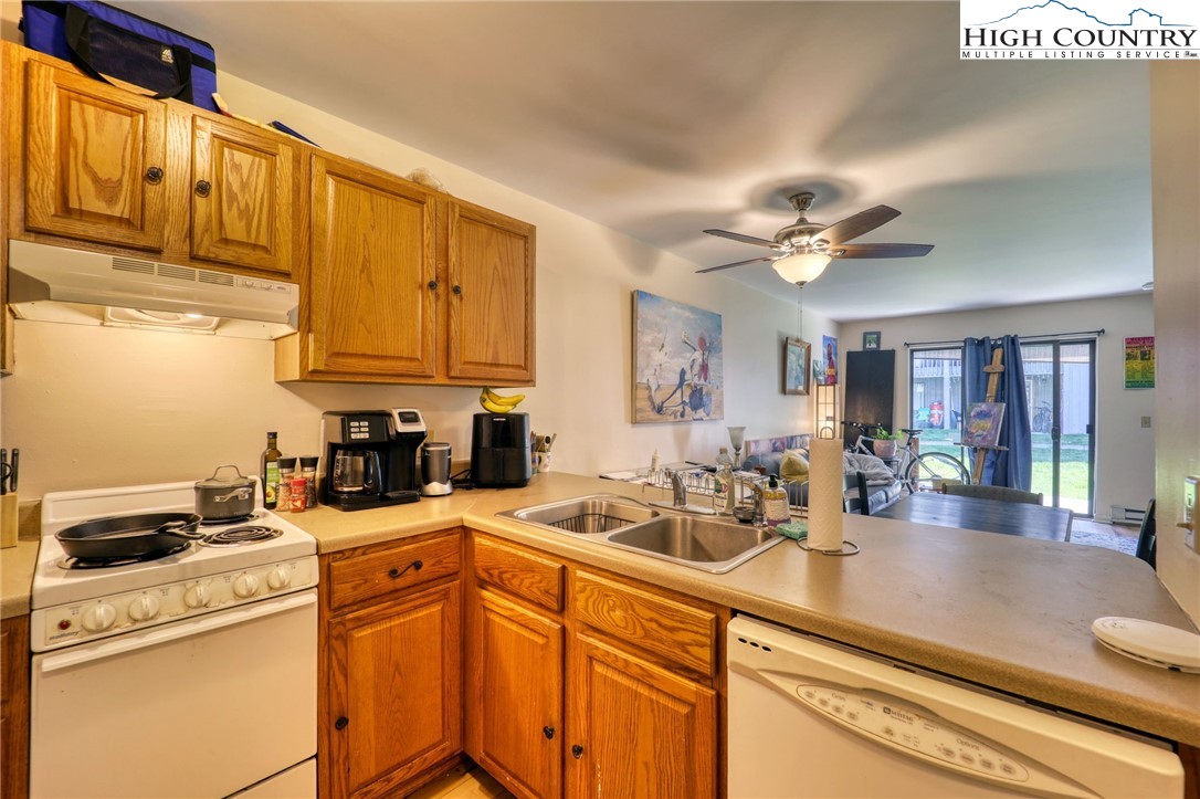 128 Zeb Street, Unit A106 Boone, NC 28607 - Photo 10 of 22 a kitchen with a sink cabinets and appliances