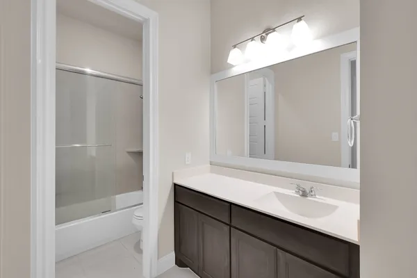 a bathroom with a bathtub and a sink