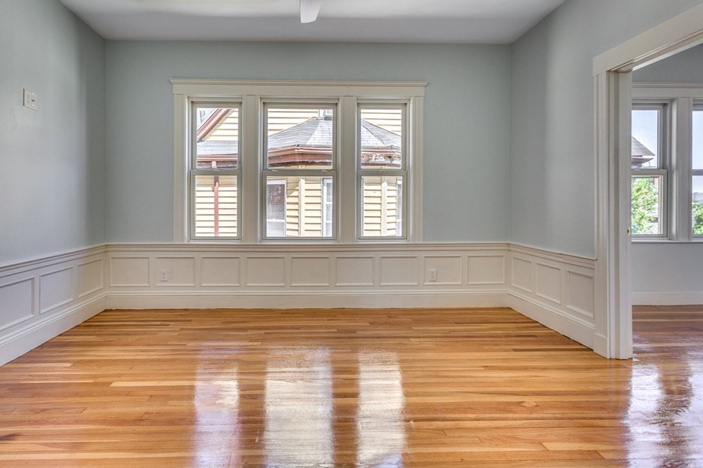 5 Greenheys Street, Unit 2 Boston, MA 02121 - Photo 6 of 10 a view of a room with wooden floor and glass windows