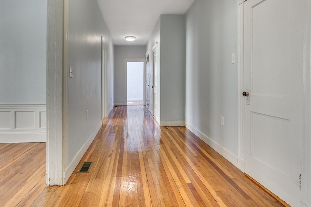 5 Greenheys Street, Unit 2 Boston, MA 02121 - Photo 8 of 10 a view of a hallway with wooden floor