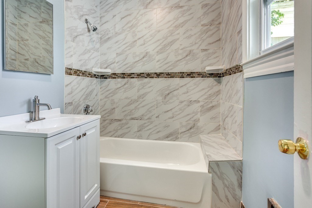 5 Greenheys Street, Unit 2 Boston, MA 02121 - Photo 9 of 10 a bathroom with a sink and a bathtub