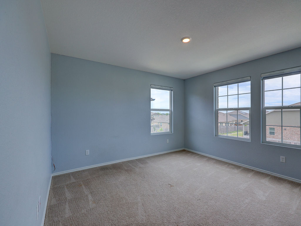 1716 Frontenac Street Leander, TX 78641 - Photo 28 of 34 an empty room with windows